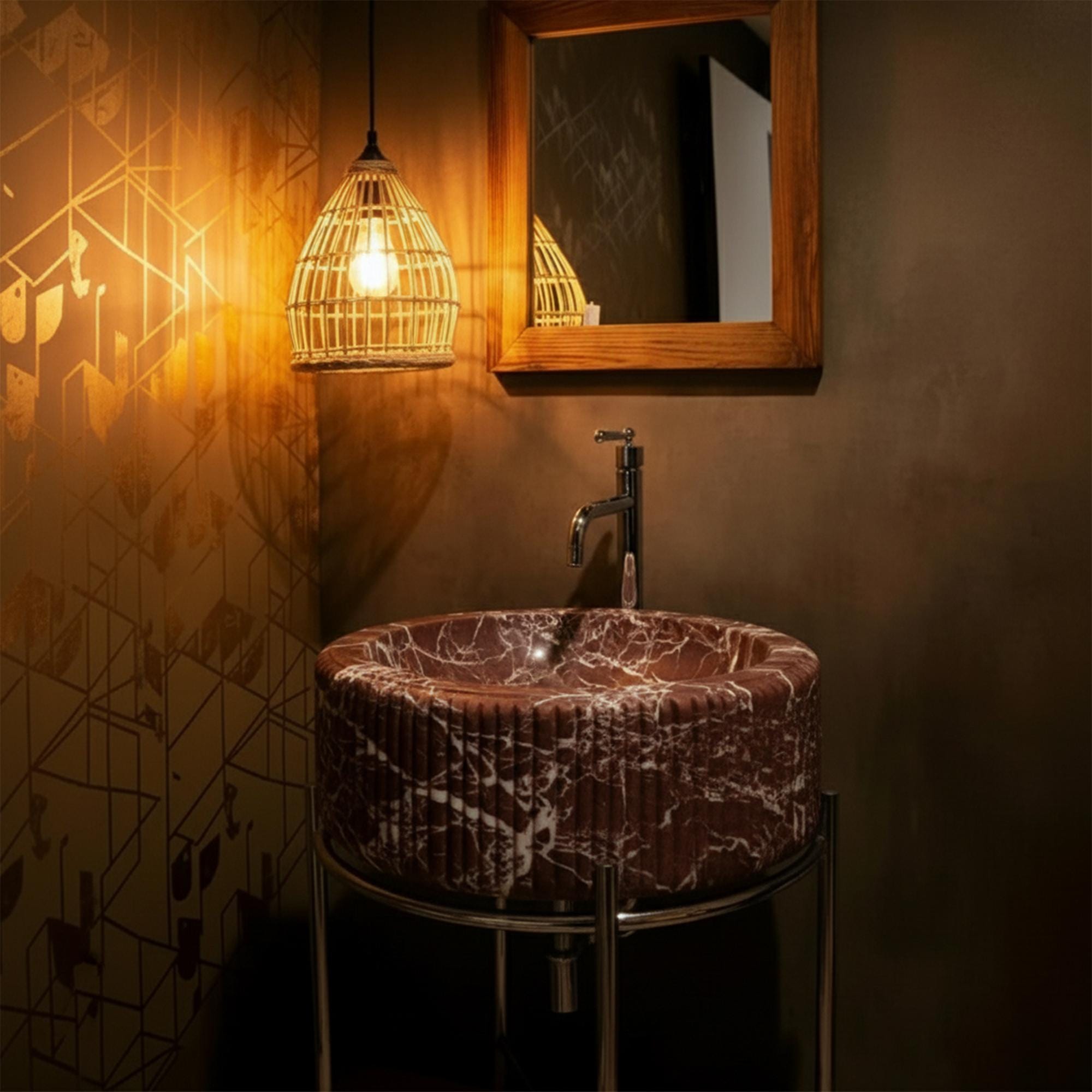 A luxury red marble wall-mounted sink with sculptural fluting and rich veining, perfect for a stylish powder room.