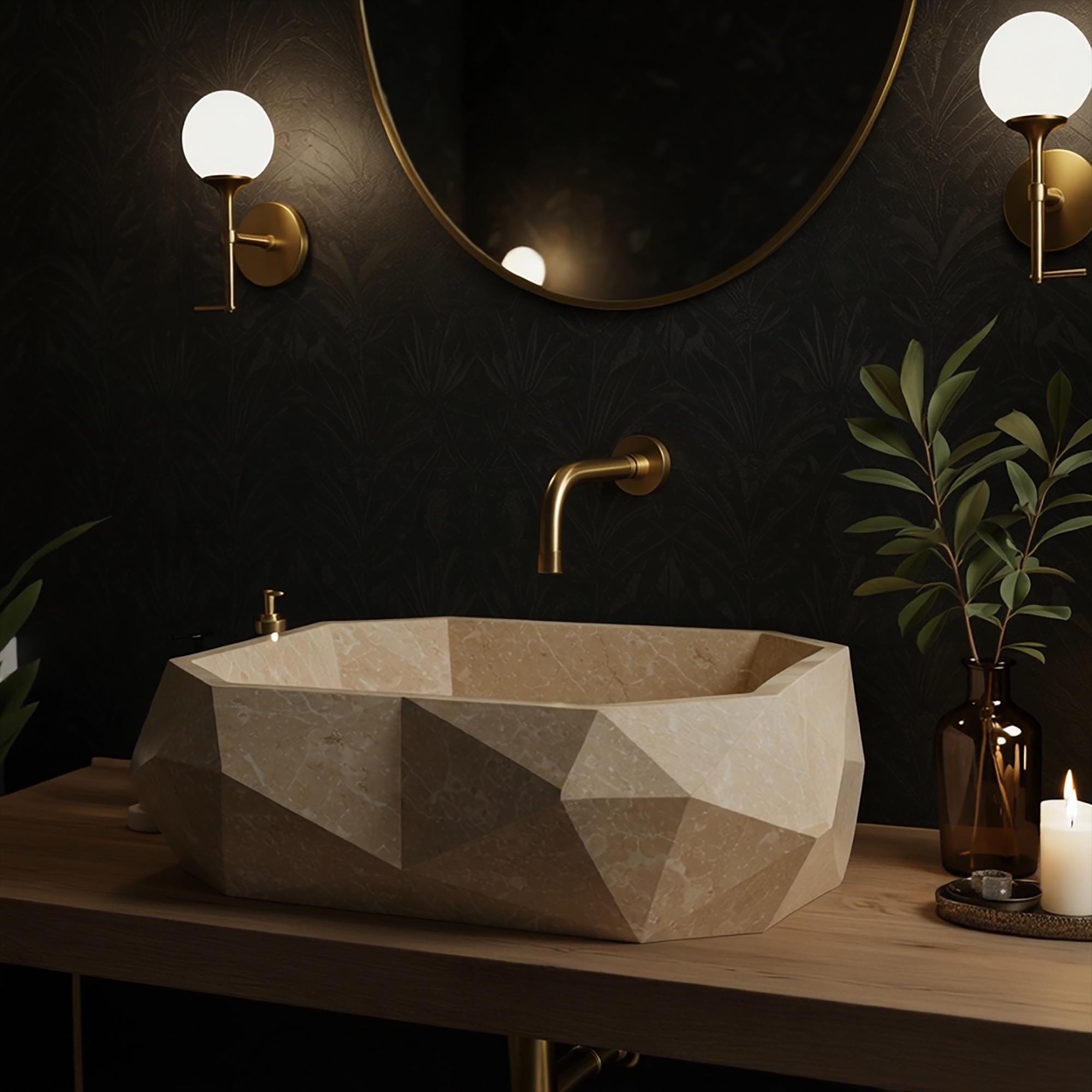 A bold geometric travertine vessel sink sits on a wood vanity with gold fixtures and soft candlelight ambiance.
